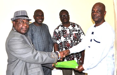 Togbe Dogbega (left), receiving handing-over notes from Obed Worlanyo Kwame Adom, his predecessor, while Professor Bakah (2nd from left), and Dr Tsatsu Adogla-Bessa, the Vice-President of the EPUC, look on.